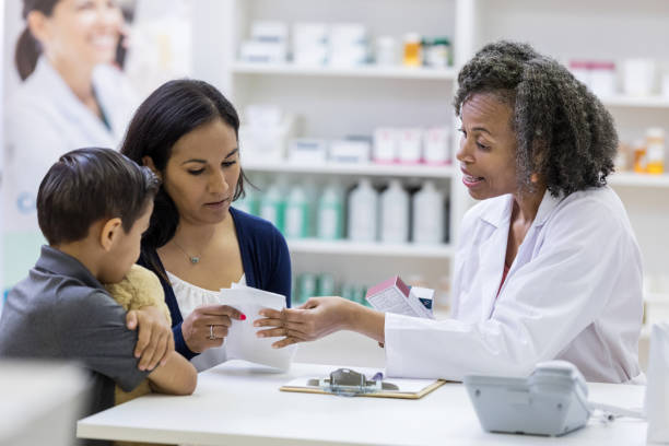 istock Pharmacist discusses a medication's side effects with patient 1149898848