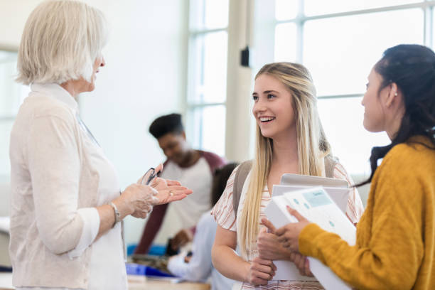 istock Mature teacher advises female students 1149898884