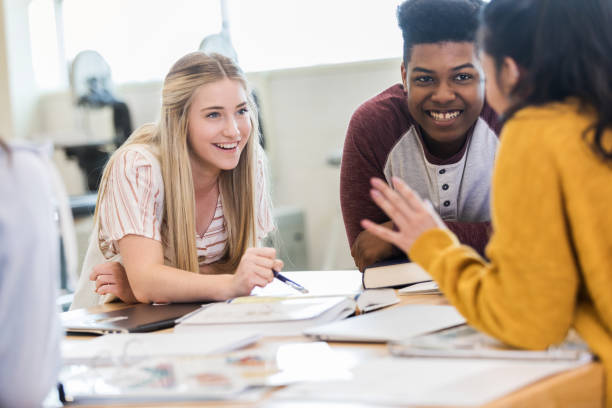 istock Happy group of high school friends studying together 1149898885