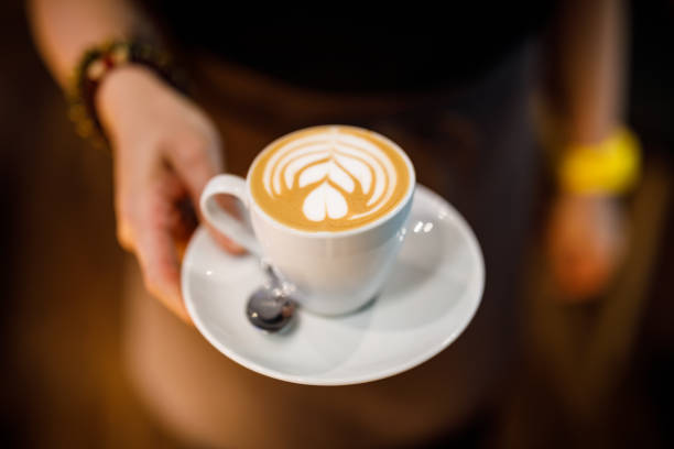 istock coffee latte in female hand 1149899023