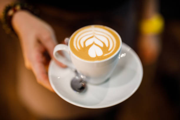 istock coffee latte in female hand 1149899109