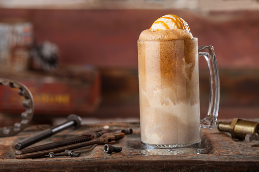 root beer float in a unique industrial background