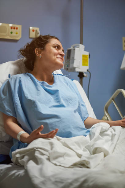 istock Young woman in clinic bed 1149907551