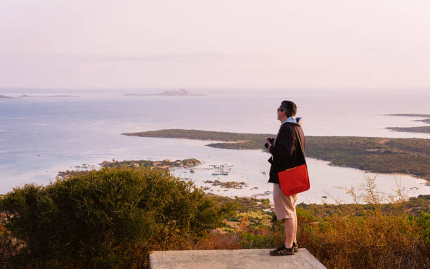 istock Sunrise or sunset and young man at Golfo Aranci 1149913040