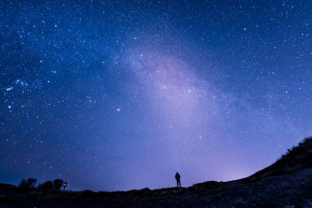 istock Senior Caucasian man starry sky background 1149915534
