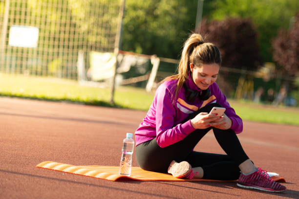 istock Young sporty woman doing exercises on mat 1149916788