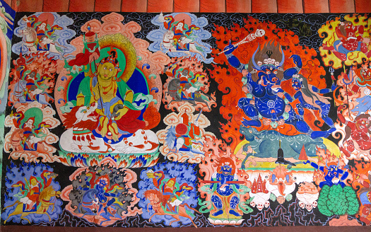 Samstanling, India - June 23, 2012: Dharmapala wrathful deity colorful wall painting, spiritual and ritual symbol of Buddhism, in Samstanling monastery, Nubra, Ladakh, India