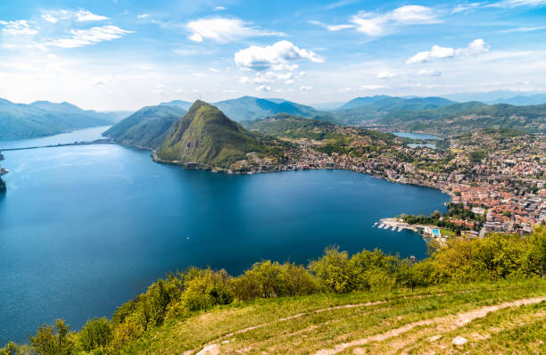 Scenic view of lake Lugano with Monte San Salvatore and Lugano town from Monte Bre,  Ticino, Switzerland Scenic view of lake Lugano with Monte San Salvatore and Lugano town from Monte Bre,  Ticino, Switzerland lugano stock pictures, royalty-free photos & images