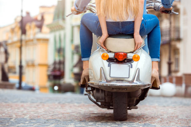 istock Young couple on scooter travel together transportation 1149934012