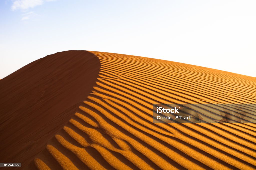 Single Sand Dune In The Desert Against Clear Blue Sky Stock Photo -  Download Image Now - iStock
