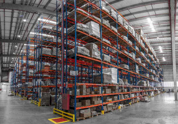 istock logistic shed and distribution boxes workers and forklift in operation 1149946091