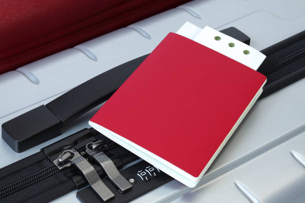 istock Passport and ticket on suitcases close-up 1149948747