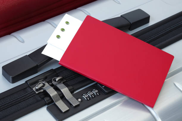 istock Passport and ticket on suitcases close-up 1149949348