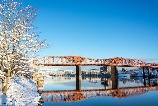 Broadway bridge reflection in winter in the Willamette River in Portland, Oregon