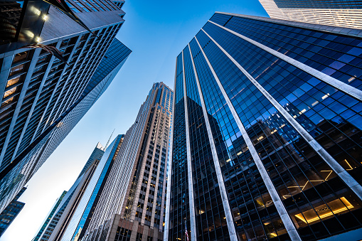 Low angle view of modern skyscrapers in Midtown Manhattan.