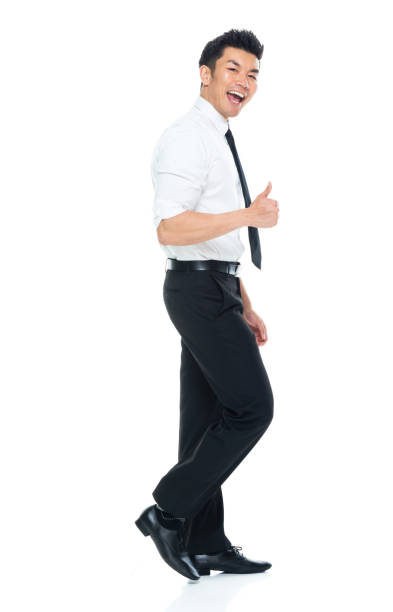 istock Handsome Asian Businessman - side view walking and doing thumbs up 1149959639