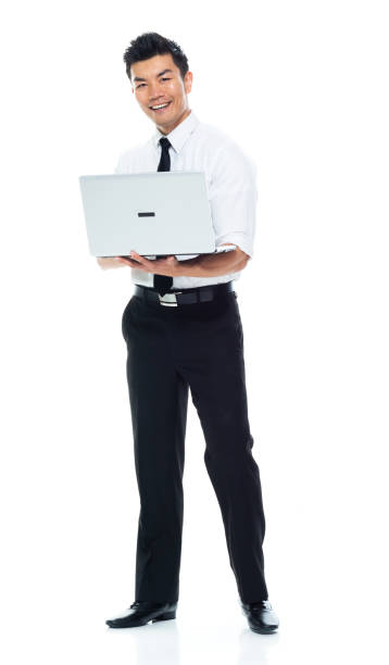 istock Handsome Asian Businessman - holding laptop, looking at camera 1149959666