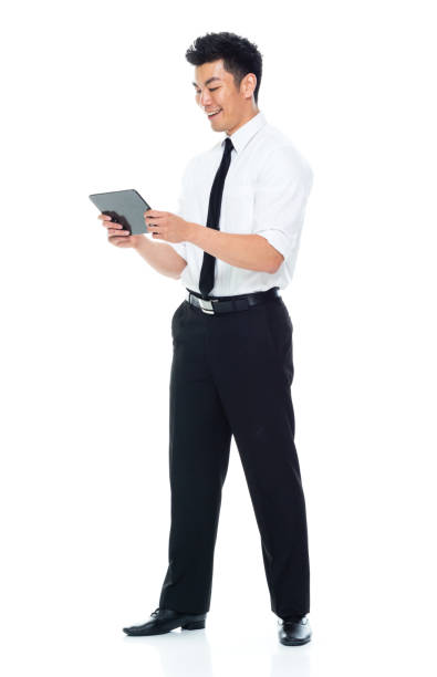 istock Handsome Asian Businessman - holding tablet, looking at digital tablet 1149959696
