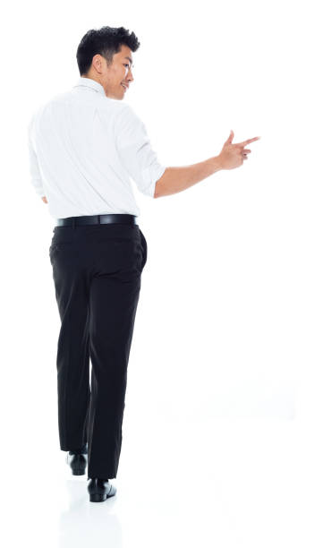 istock Handsome Asian Businessman - rear view walking and doing finger gun 1149959700