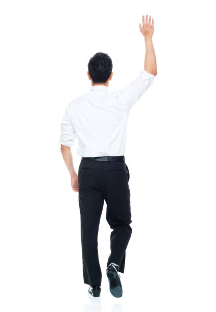 istock Handsome Asian Businessman - walking and waving 1149960219