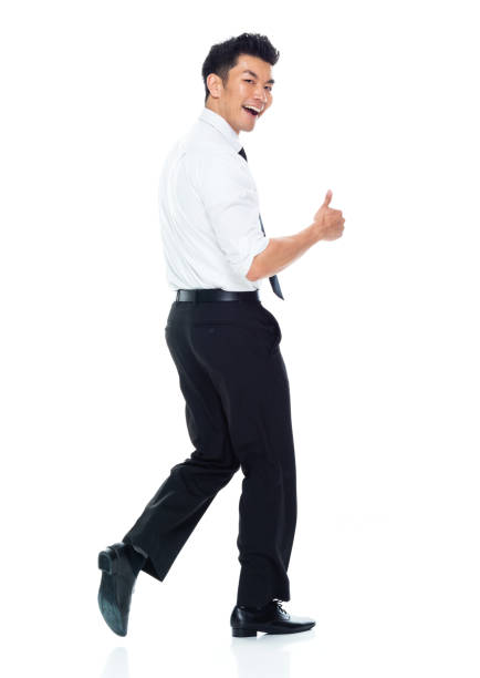istock Handsome Asian Businessman - rear view walking and doing thumbs up 1149960279