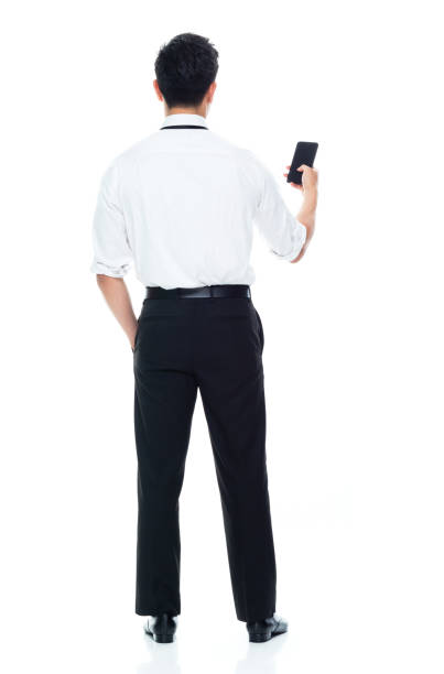 istock Handsome Asian Businessman - texting on smart phone 1149961040