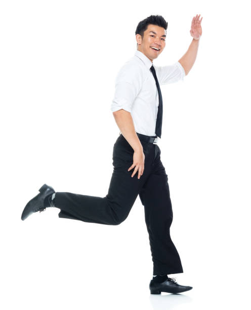 istock Handsome Asian Businessman - running and waving 1149961537