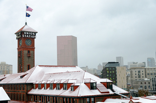 Cityscape view of Portland, Oregon and the train station during winter snow