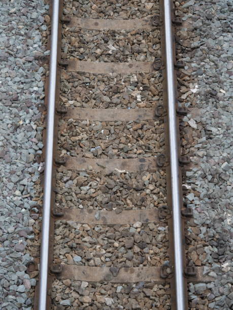 istock Top view of the train tracks with train and rock restraints in construction 1149966135