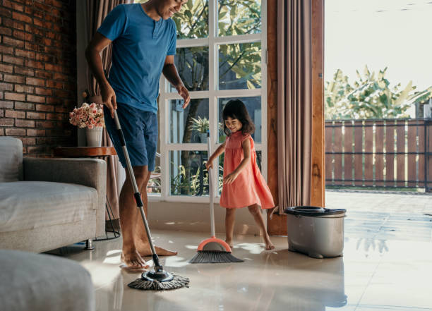 istock little girl help her daddy to do chores 1149969312