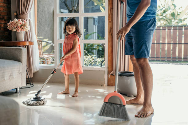 istock little girl help her daddy to do chores 1149970098