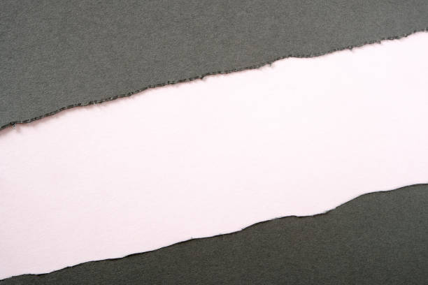 istock Gray paper torn ripped strip white background diagonal 1149975556