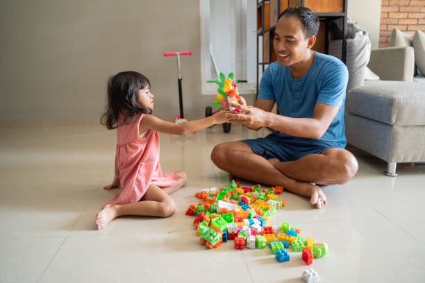 istock father and daughter playing puzzle 1149975704