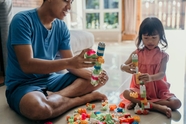 istock father and daughter playing puzzle 1149975710