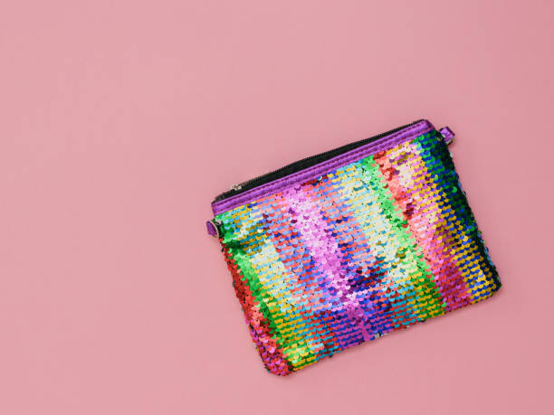 istock Multi-colored women's bag on a pink background. Fashion women's accessory. Flat lay. 1149980269
