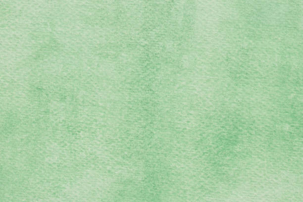 istock green watercolor painted on paper  background texture macro 1149987983