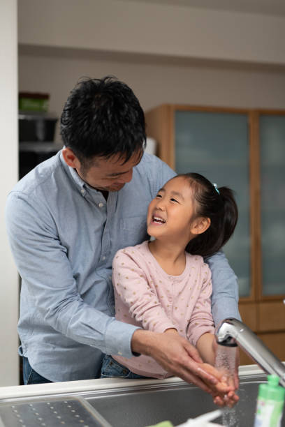 istock Father talking to daughter in kitchen 1149995518
