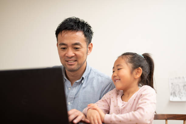 istock Father working at home with child 1149996097