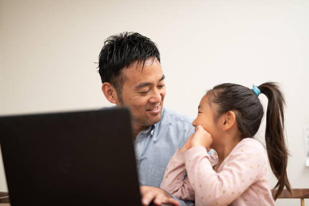 istock Father working at home with child 1149996169