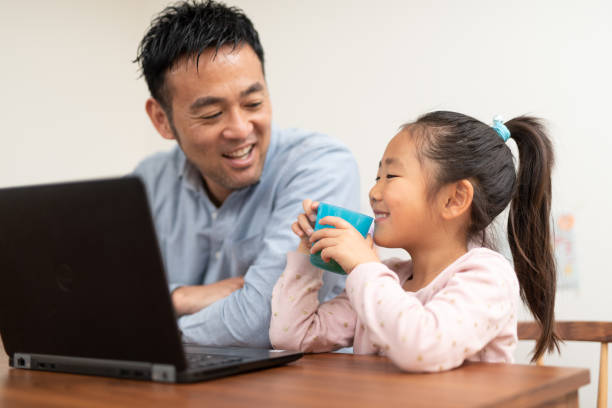 istock Father working at home with child 1149996291