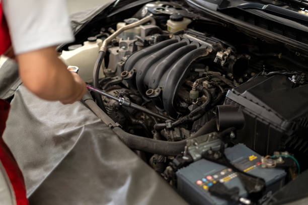 istock mechanic working car maintenance with soft-focus and over light in the background 1149997691