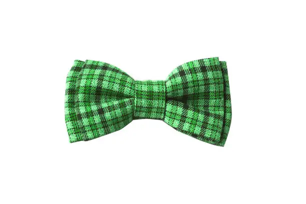 Photo of green bow tie with sequins for St. Patrick's Day isolated on white