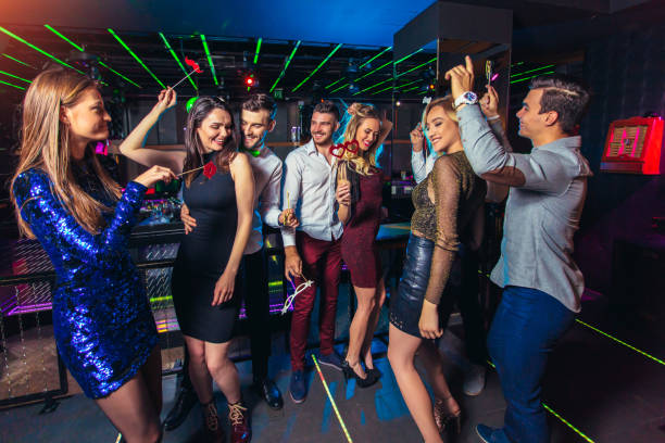 istock Young people dancing in night club 1150014810