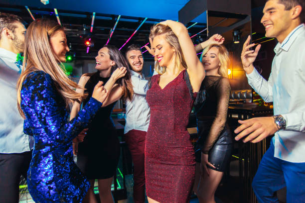 istock Young people dancing in night club 1150014831