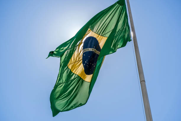istock Brazilian flag on flagpole 1150015613
