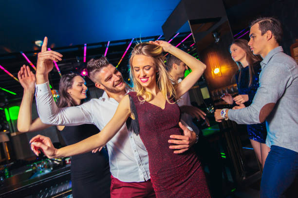 istock Young people dancing in night club 1150017437