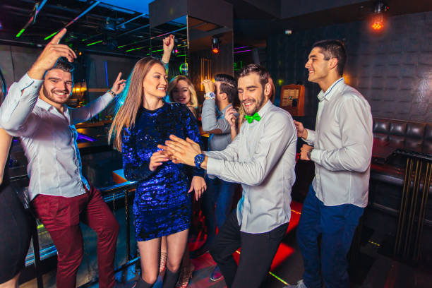 istock Young people dancing in night club 1150017877