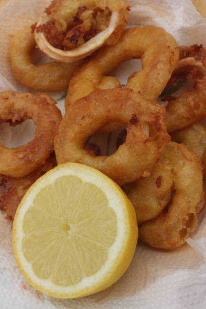 istock Squid fritters served with lemon 1150018522