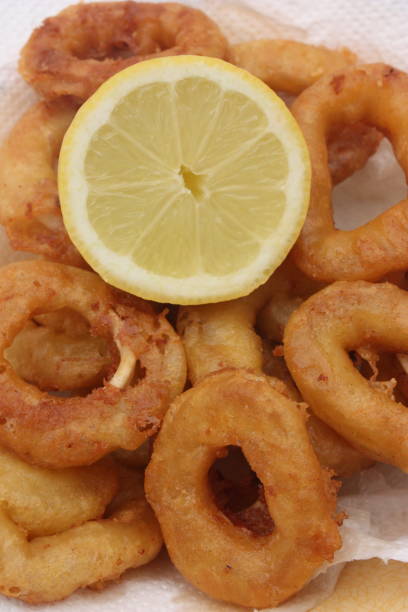 istock Squid fritters served with lemon 1150018527