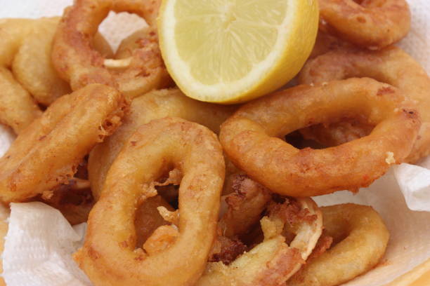 istock Squid fritters served with lemon 1150018551